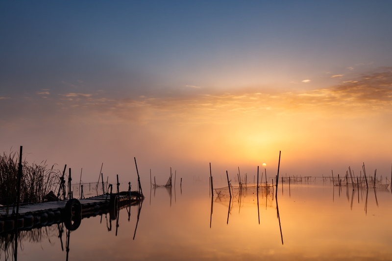 lake, non-urban scene, water, wooden post, beauty in nature, scenics - nature, sky, 5K, reflection, fishing industry, nature, sunset, idyllic, tranquil scene