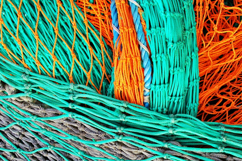 complexity, fishing net, rope, commercial fishing net, tangled, fishing, strength, no people, pattern, orange, backgrounds, high angle view, still life