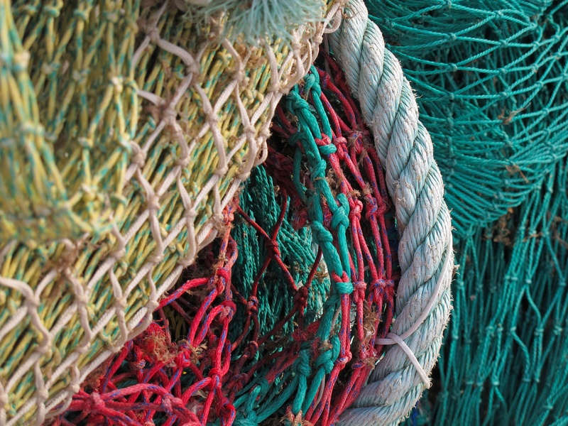 strength, fishing, multi colored, textured, outdoors, no people, pattern, complexity, blue, pile, network, turquoise colored, day, commercial fishing net
