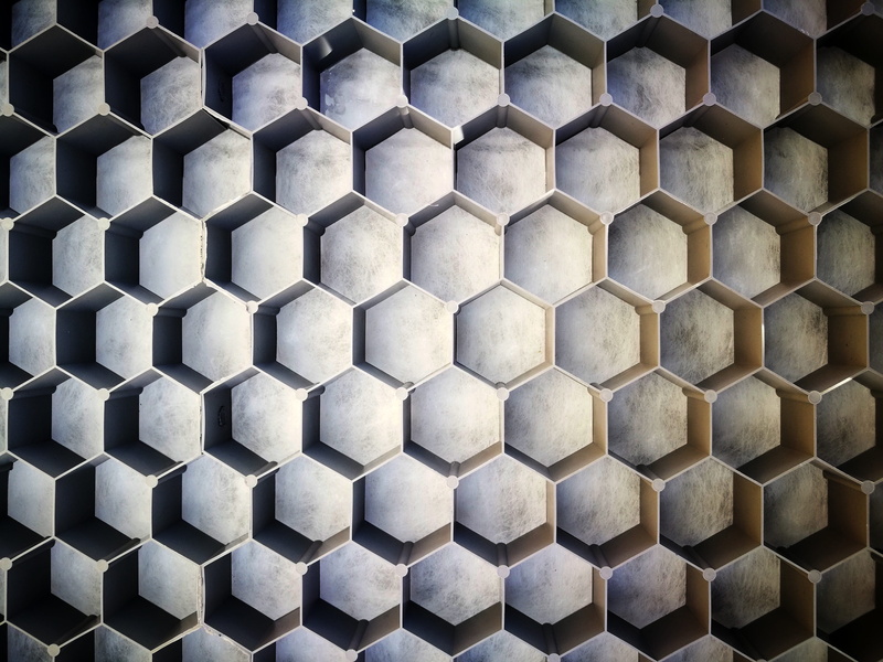 wall - building feature, uniform, repetition, grid, day, symmetrical, pattern, geometric shape, architecture and art, shape, gray, textured, no people