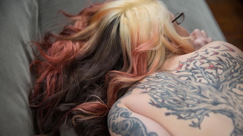 hairstyle, women, furniture, portrait, leisure activity, indoors, tattoo, headshot, beautiful woman, long hair, relaxation, real people, lying down, model