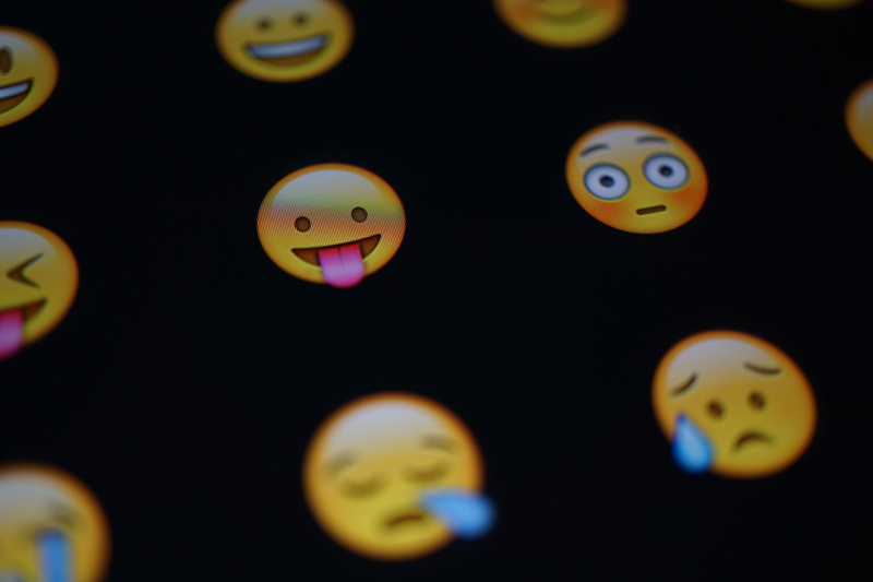 studio shot, funny, 5K, creativity, close-up, multi colored, representation, faces, smiling, emojis, shape, black background, circle, emoji, indoors, no people