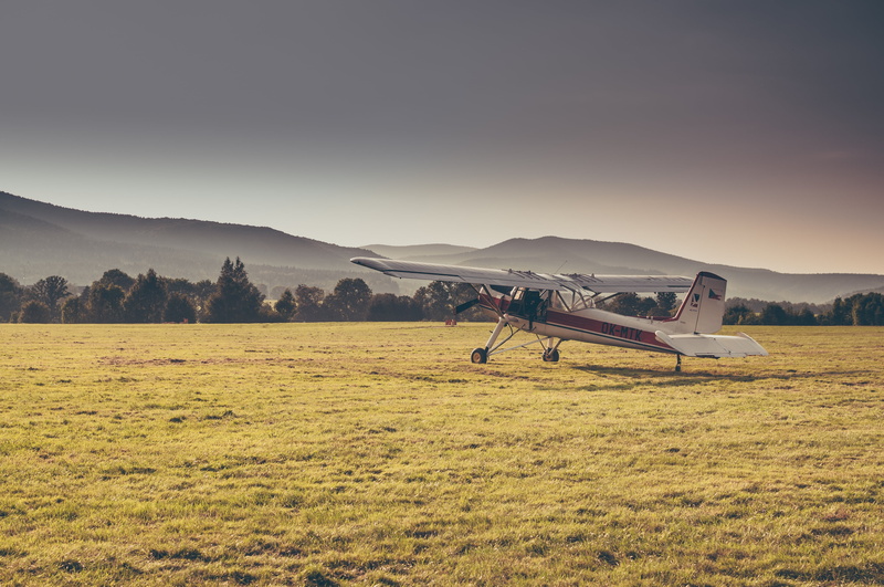 mode of Transport, commercial Airplane, biplane, tranquility, scenics - nature, blue, leisure activity, grass, retro Styled, airfield, travel, air, outdoors