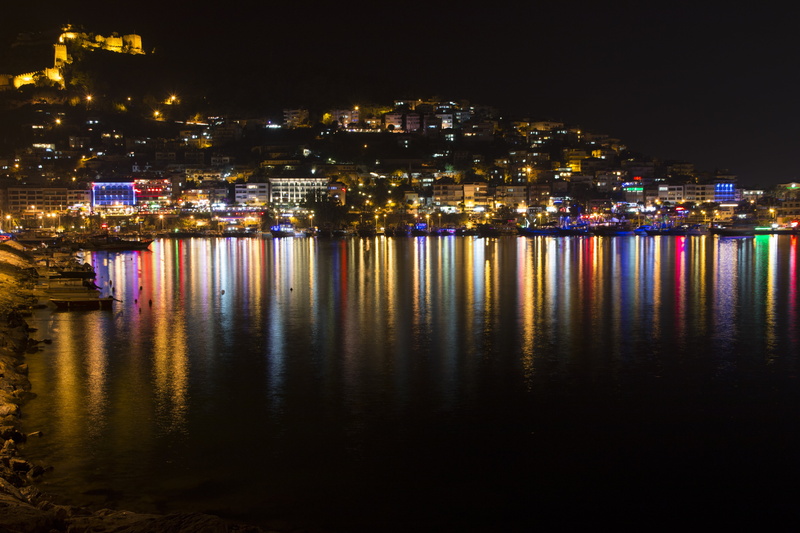 outdoors, skyscraper, city life, alanya castle, sea, illuminated, architecture, bay, cityscape, built structure, blue, harbor, coastline, nature, turkey
