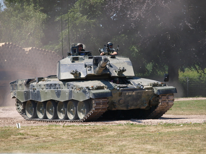 government, outdoors, field, Challenger, day, incidental people, army, black, military training, transportation, British, tank, tree, plant, nature, weapon