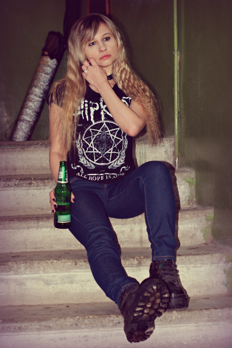 real people, bottle, beauty, beautiful woman, looking at camera, fashion, entrance, carlsberg, lifestyles, sad, beer, portrait, lovely, young women, woman