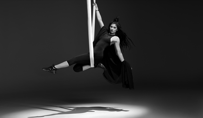 Puma Fierce, vitality, beautiful woman, black background, adult, lifestyles, arms raised, young women, 8K, jumping, one person, studio shot, females, Kylie Jenner