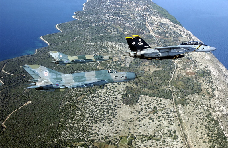water, nature, vehicle, outdoors, nautical vessel, flying, F-14 Tomcat, sea, military, mode of transportation, sunlight, beach, aircraft, land, 720P, high angle view