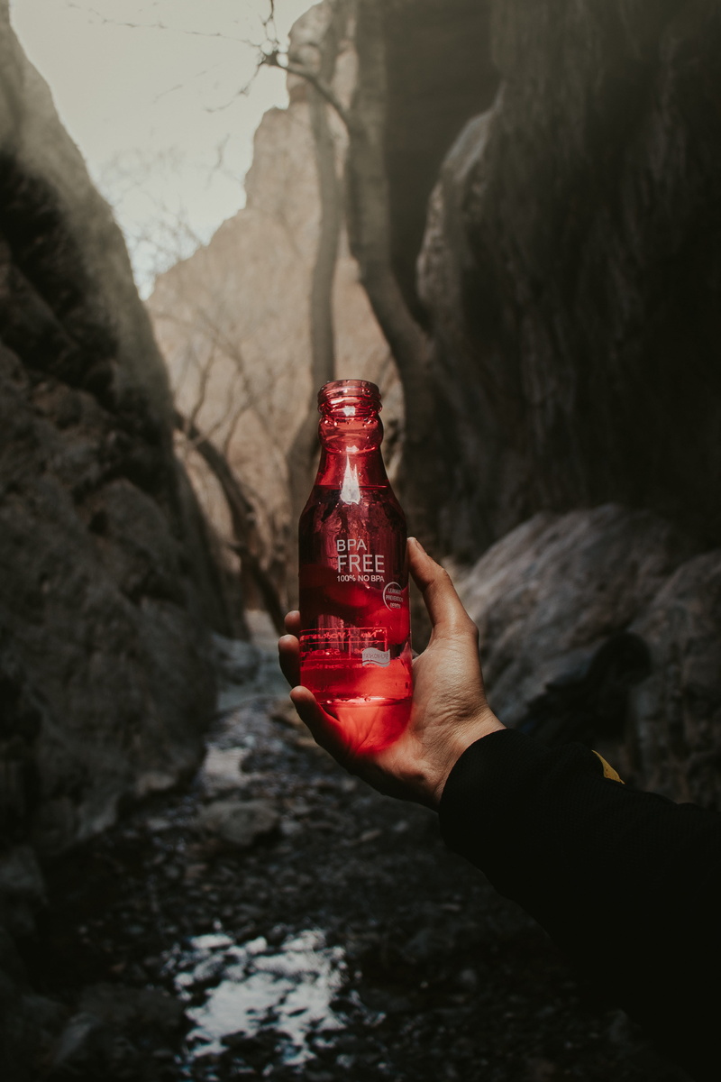 body part, rock - object, moody, machine, coca, human hand, focus on foreground, holding, solid, water, drink, person, dark, red, human, alcohol, 4K, day
