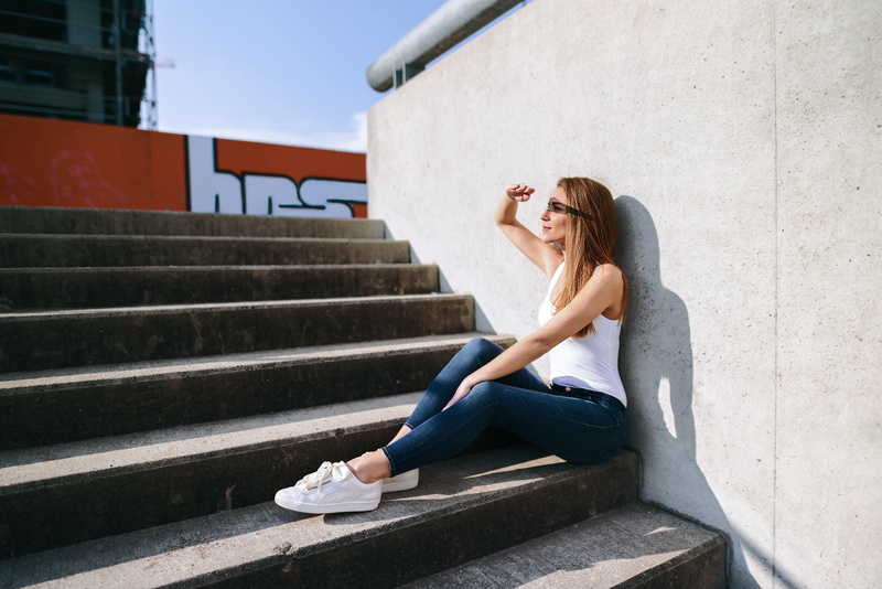 long hair, day, sneakers, architecture, staircase, fashion, jeans, built structure, leisure activity, real people, stairs, lifestyles, casual clothing