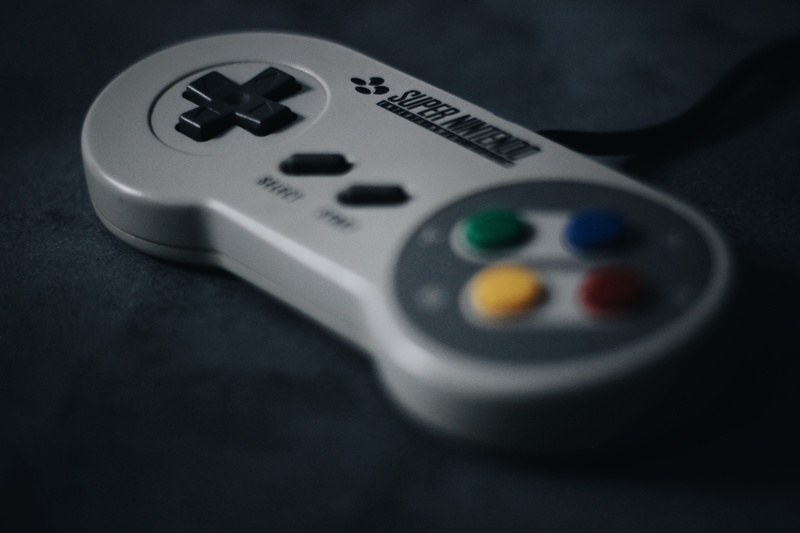 snes, close-up, excess, control, surface, remote, nutritional supplement, choice, television set, indoors, arts culture and entertainment, black background