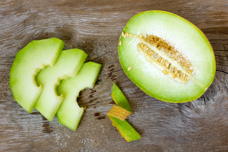 indoors, melons, green color, still life, no people, freshness, seed, chopped, wood - material, high angle view, avocado, studio shot, slice, kiwi, food