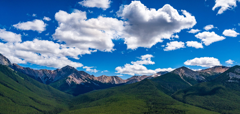 travel, tranquil scene, environment, forest, blue sky, green color, tranquility, mountain peak, mountain ridge, scenics - nature, sunny, no people, valley