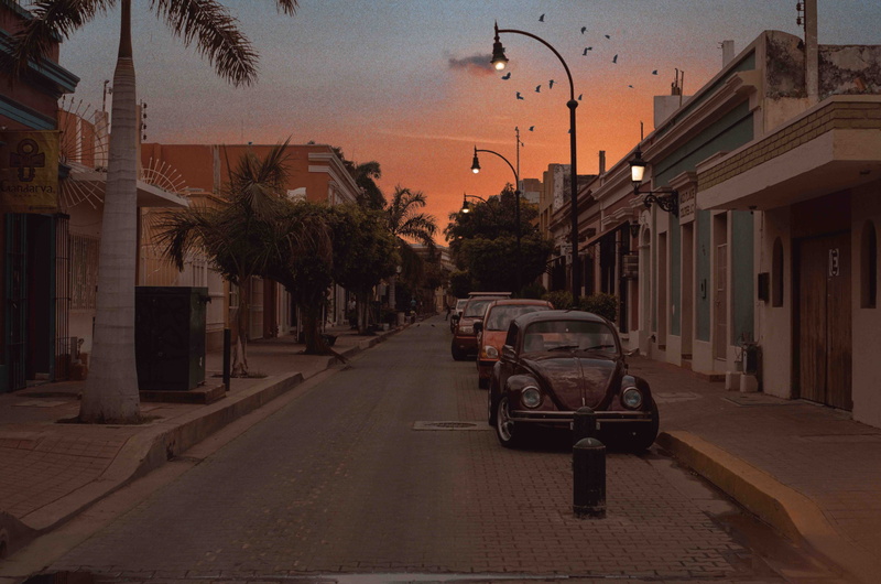 mazatlan, car, building, sunset, incidental people, built structure, tree, mexico, nature, architecture, motor vehicle, palm tree, transportation, city