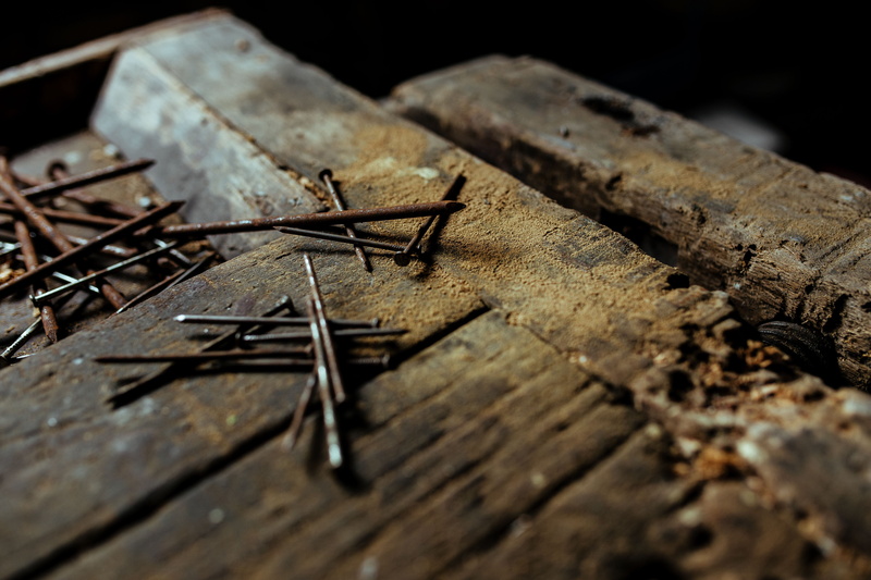 spanner, no people, equipment, black background, run-down, wood, rusty, wood - Material, selective focus, textured, work Tool, bolts, garage, indoors, nuts