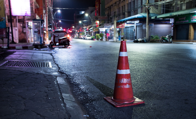 city, incidental people, protection, traffic cone, outdoors, road, communication, quiet, path, the light, loneliness, city street, sign, solitude, building exterior