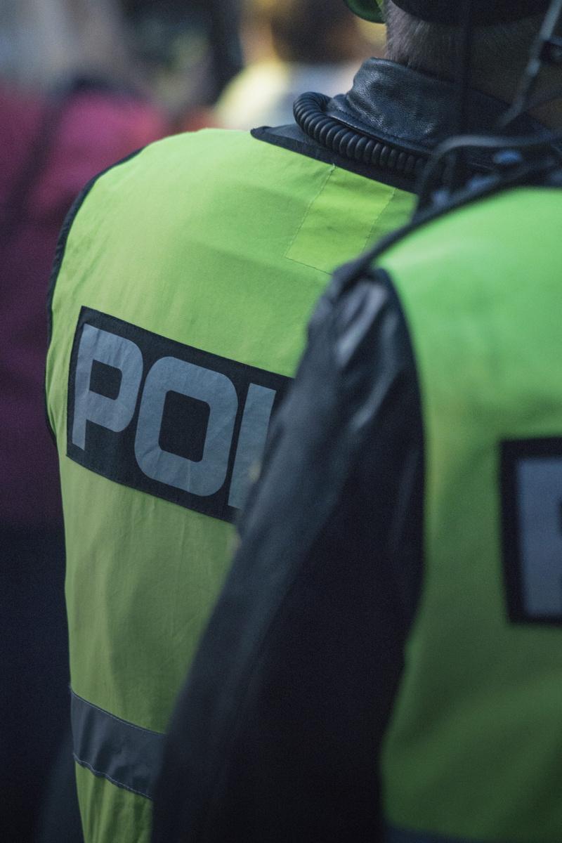 Police, sport, green, high visibility, uniform, authority, person, day, human body part, man, clothing, vest, american football - sport, backpack, flag