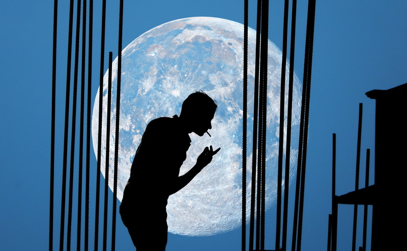 Smoking, leisure activity, standing, males, indoors, man, day, Silhouette, Moon, one person, sky, men, three quarter length, side view, blue, glass - material