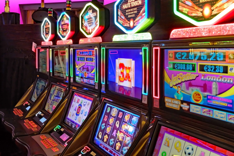 arts culture and entertainment, text, leisure games, gambling, casino, large group of objects, slot machines, communication, technology, close-up, game of chance
