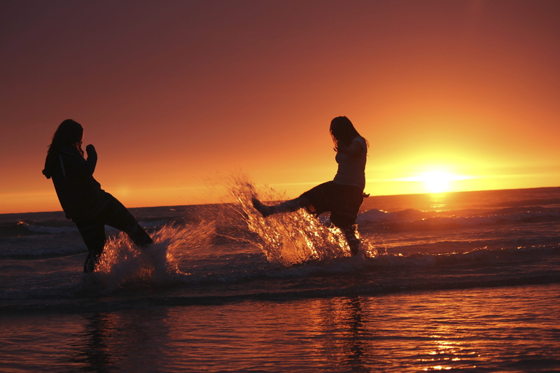 lifestyles, nature, sea, playing, motion, two People, happy, holiday, females, shore, side view, dusk, women, sunlight, men, leisure activity, woman, swim