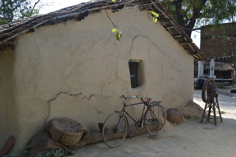 architecture, tree, stationary, outdoors, straw, 2K, hut, mud, countryside, built structure, nature, indian village, no people, house, day, mode of transportation