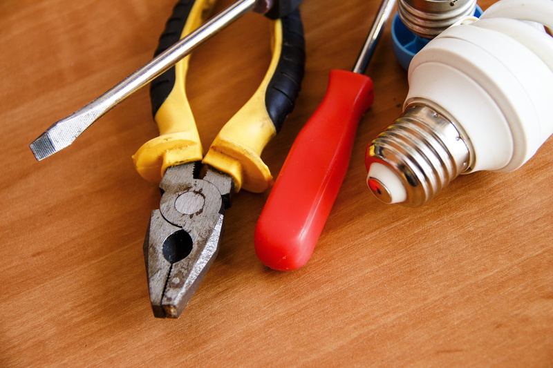 5K, electrician, electric, table, high angle view, repair, group, indoors, group of objects, hand tool, security, pliers, wood - material, no people, red