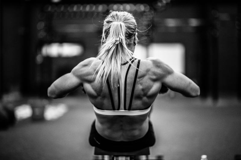 hairstyle, lifestyles, muscular build, determination, vitality, women, muscles, athlete, sport, exercising, clothing, strength, focus on foreground, bodybuilding