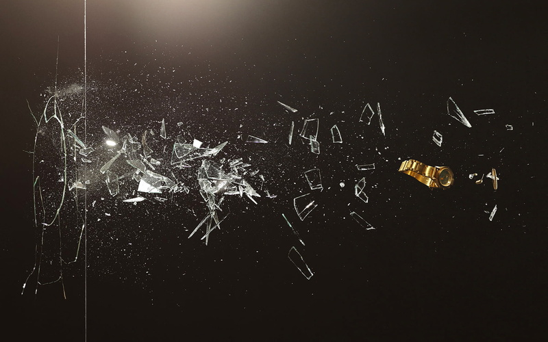 black background, studio shot, blurred motion, gold, fragments, aggression, black Color, illuminated, communication, novel Lauren, motion, mid-air, creativity