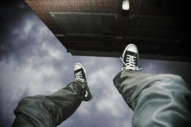 human body part, real people, shoe, low section, fear, bankrupt, jump, anti-gravity, cloud - sky, danger, upside down, body part, activity, canvas shoe