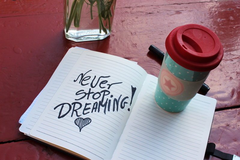 notes, plastic, western script, close-up, day, communication, glass, container, red, table, quote, dream, drinking, target, bottle, white, notebook, near