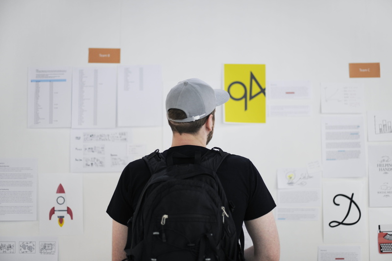 text, goals, rear view, office, real people, mission, standing, wall - building feature, person, adhesive note, man, development, 4K, management, show