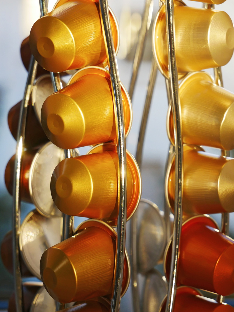 coffee, arrangement, metal, large group of objects, no people, still life, indoors, art and craft, coffee capsule holder, abundance, gold colored, business