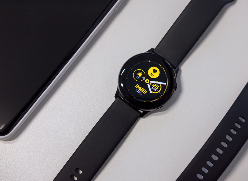 steering wheel, gold, surface, portable information device, wireless technology, indoors, phone, wristwatch, mobile phone, black color, single object, smartwatch