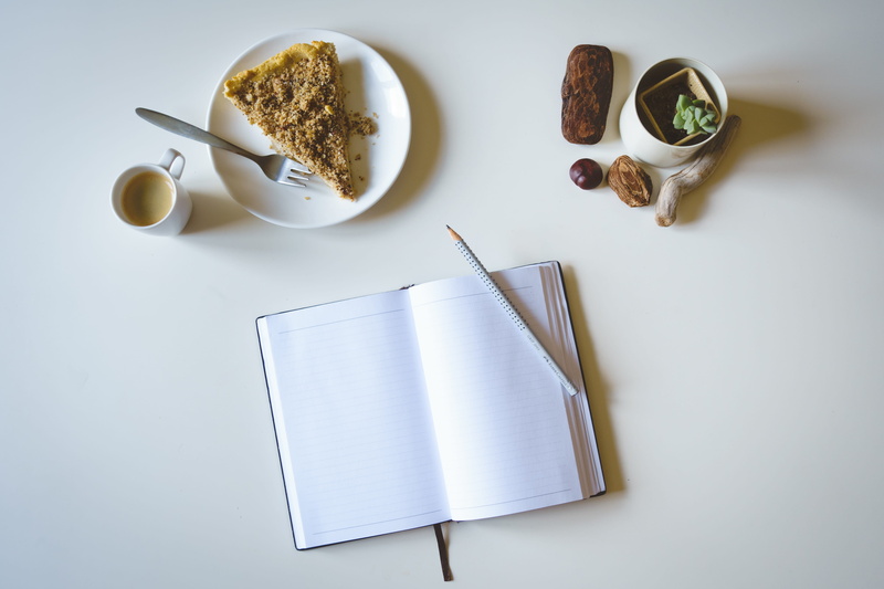 food and drink, cake, indoors, high angle view, coffee cup, coffee, directly above, no people, top view, table, drink, white background, book, refreshment