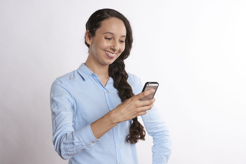 casual clothing, modern, internet, mobile phone, telephone, looking, analytics, texting, connection, attractive, front view, smartphone, messaging, using