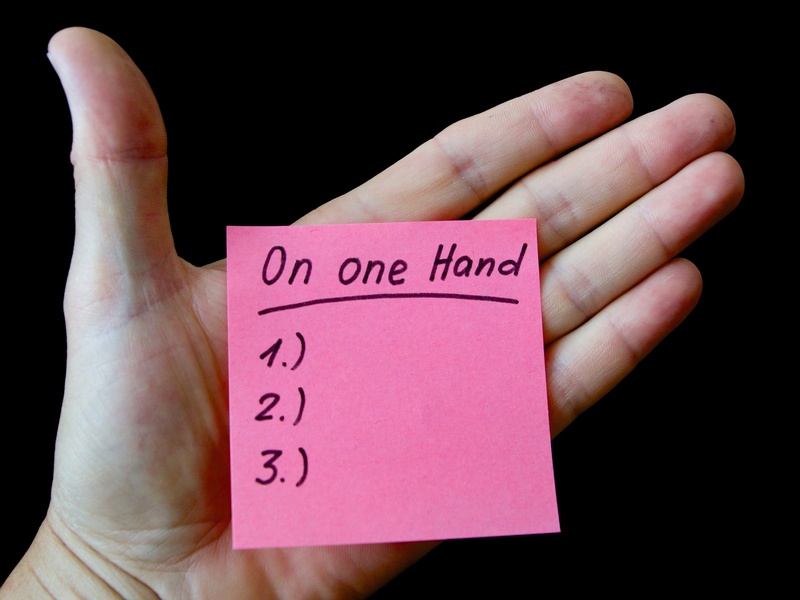 person, communication, pink, hand, embassy, message, positive emotion, body part, one person, sticky, on the one hand, black background, list, text, indoors