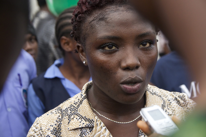 protest, close-up, group of people, arts culture and entertainment, wireless technology, adult, looking, telephone, monrovia, jewelry, incidental people