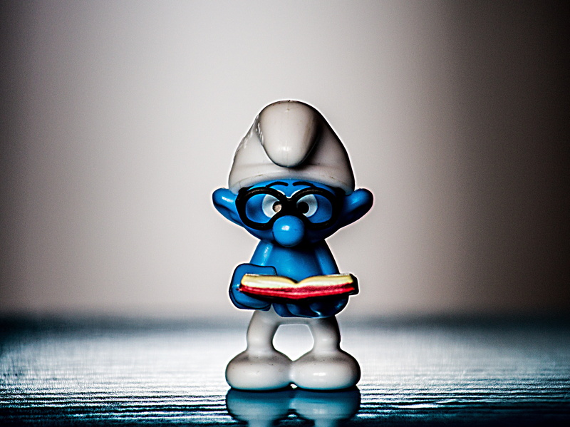 surface, indoors, studio shot, toy, humor, blue, no people, close-up, robot, 4K, focus on foreground, creativity, still life, brainy, figurine, table