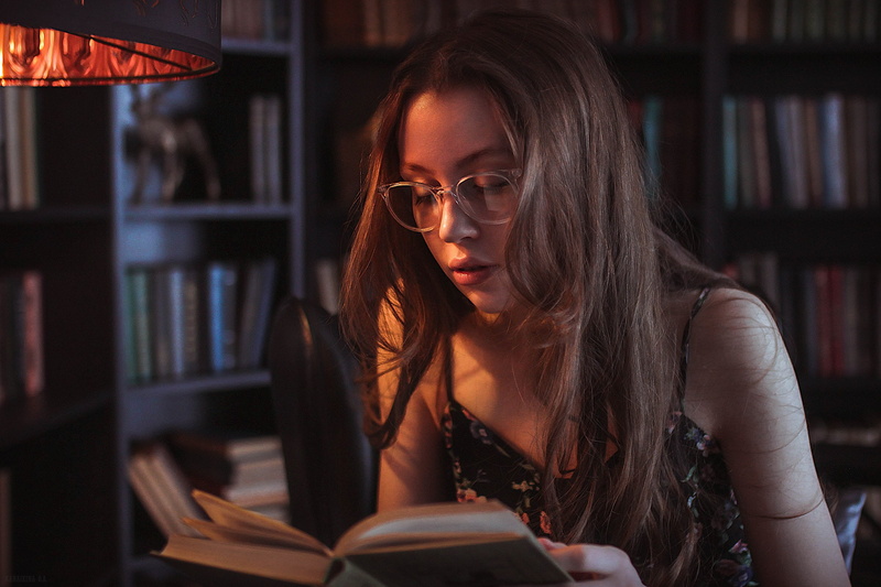 model, looking, studying, learning, women, books, leisure activity, reading, publication, one person, adult, activity, sitting, bookshelf, literature, lifestyles