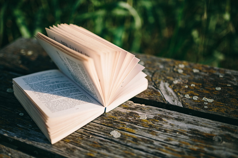hardcover Book, open, outdoors, reading, selective focus, page, library, resting, relaxing, wisdom, still life, magic hour, no people, close-up, paper