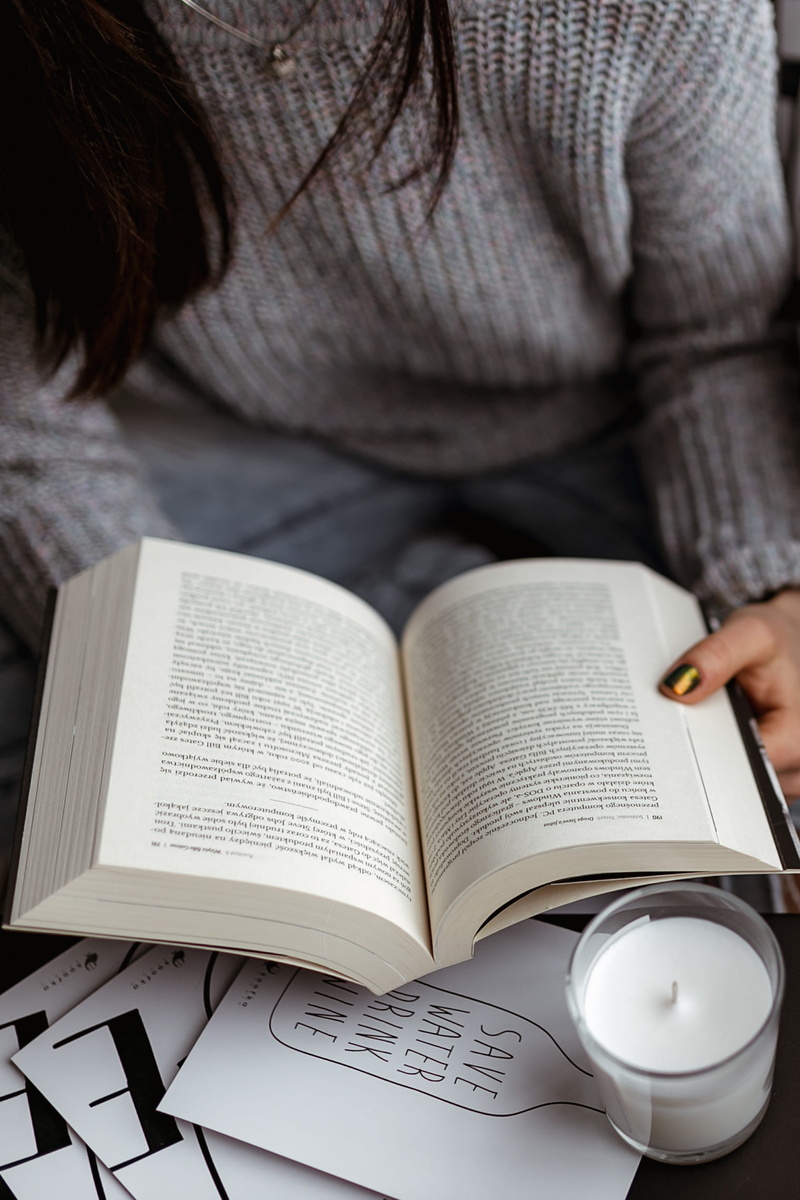 girl, lifestyle, learning, reading, holding, time, adult, book, reads, relax, opened book, indoors, women, education, studying, front view, jumper, sweater