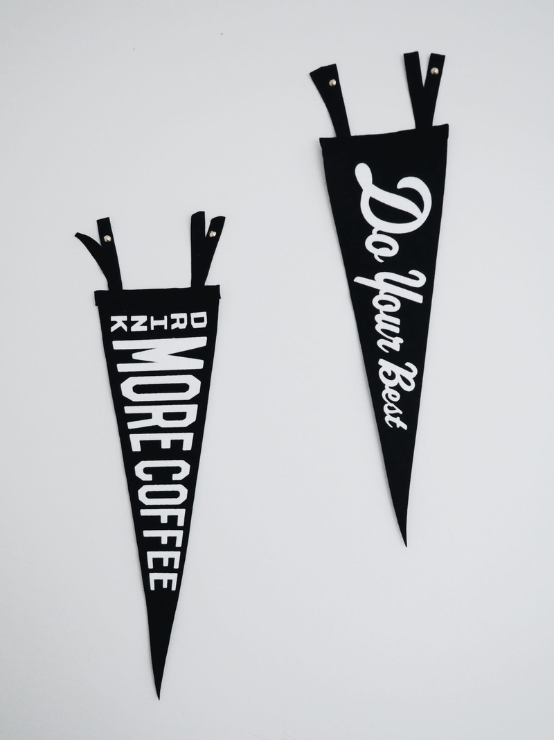 capital letter, texts, number, banner, western script, table, two, single word, sign, white, banners, painted, white color, text, typography, wall, indoors
