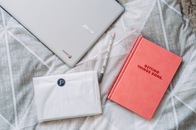 furniture, productivity, no people, directly above, paper, things, indoors, clothing, white color, button down shirt, pocket, menswear, done, text, high angle view