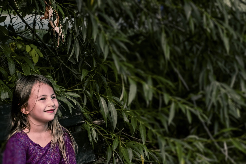 outdoors, child, lifestyles, childhood, waiting, innocence, plant, green, real people, growth, women, beginning, hairstyle, headshot, girl, one person