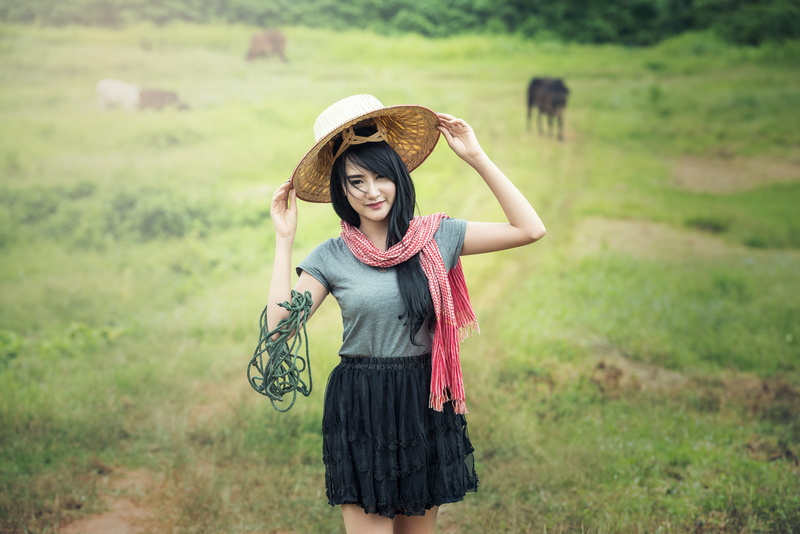 outdoors, beautiful woman, vietnam, hat, hats, young women, woman, land, green, young adult, field, tour, real people, standing, day, smiling, water, holidays