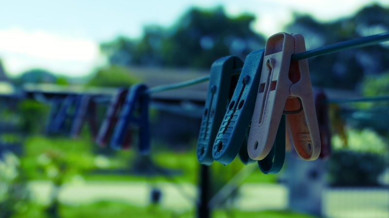 clothespin, clothesline, focus on foreground, in a row, group of objects, hanging, string, clothing, close-up, outdoors, laundry, day, 5K, blue, drying