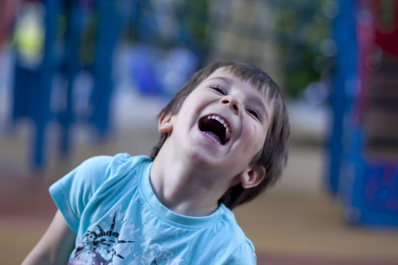 indoors, focus on foreground, portrait, shirt, smiling, neck, looking up, blue, laughter, brown hair, casual clothing, laughing, males, happy, mouth, photography