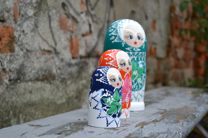 collection, female likeness, russian, floral pattern, creativity, figurines, doll, outdoors, wall, focus on foreground, close-up, wood, human representation