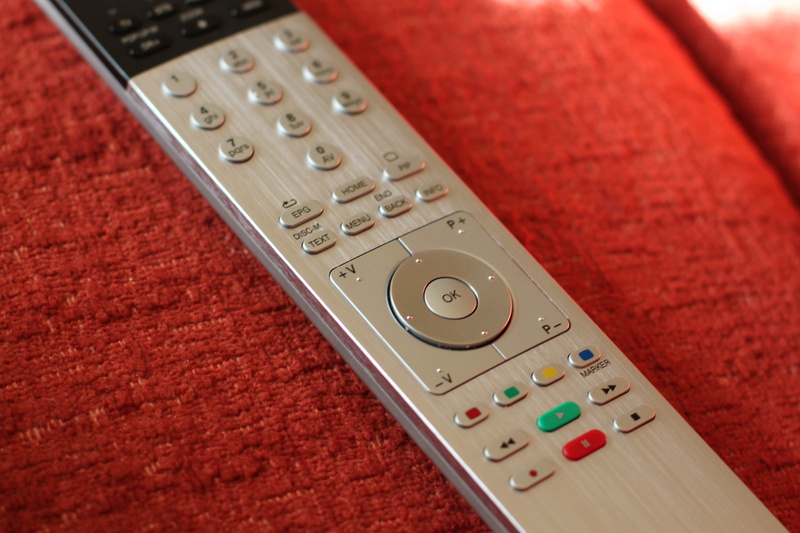 high angle view, indoors, control, dvd recorder, close-up, wireless technology, keypad, relaxation, connection, remote control, loewe assist, home entertainment