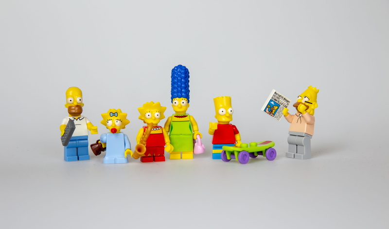 large group of objects, bart, still life, fun, childhood, human representation, order, multi colored, family, lisa, colored background, marge, variation